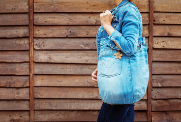 girl with a handmade jeans bag, product concept woman's fashion