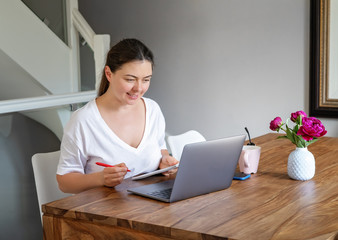 Girl working or studying online from home. Freelance, online work, studying, learning and...