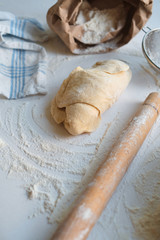 Knead dough from flour on the wooden table. Preparing the dough for baking. Cooking homemade cuisine for family. Chef workplace in kitchen. Making pastry. Healthy delicious culinary recipe