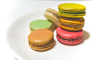 Closed-up colorful pastel macarons background