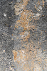 Close-up Detail of  Textured Grey Limestone Rockface with Speckled Brown Algae