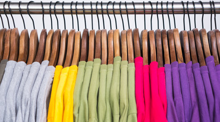 Few colored t-shirts on hangers