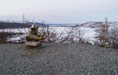 A post made of stones. Norwegian troll. The countryside of Hardangervidda Park.