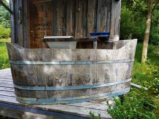 Exterior bathroom with wooden tub on terrace