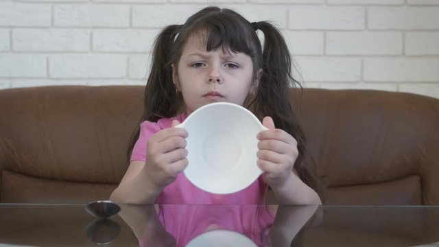 Child with empty plate.