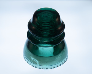 Antique green glass insulator from a telephone line 