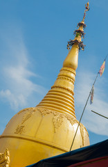 Myanmar Travel Images of golden stupa spire.