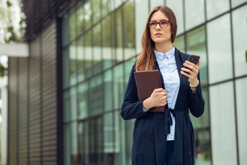  Portrait of a woman using a cell phone