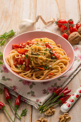 spaghetti with fresh tomatoes capers garlic and nuts