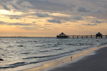 Sunset at the beach with a Pier