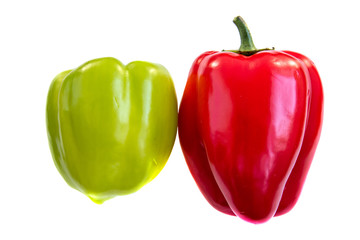 Two red and green sweet peppers isolated on white background side view