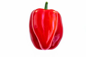 One red sweet paprika pepper isolated on white background side view