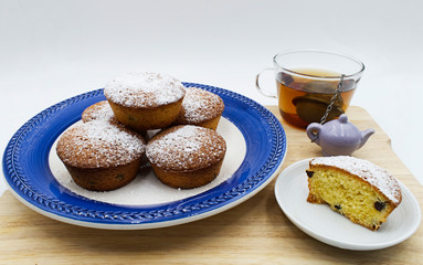 Dessert tea with Muffins on wooden table. 