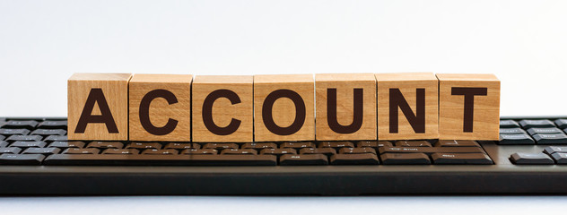 Account word written on wood block. Account text on wooden table for your desing, concept.