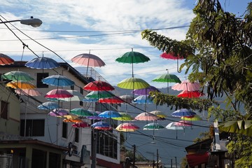 Umbrellas hanging above street in Dominican Republic