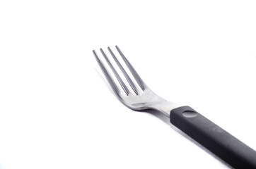 metal fork with a black handle on a white background