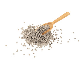 White pepper peas in wooden spoon closeup on white background, top view