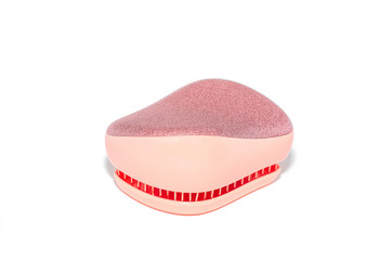 Pink detangling Brush on a white background. pink comb. wooden comb.