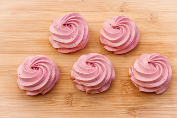 airy melting homemade cherry marshmallow on green apple granny smith