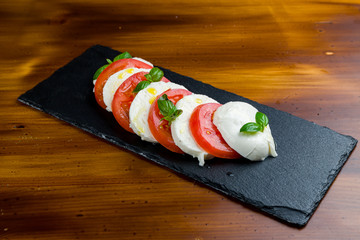 Caprese salad with mozzarella and tomato