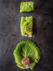 Obraz premium Kale leaves stuffed with meatballs. Overhead shot.