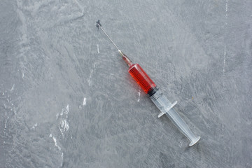 syringe with medicine in hand
