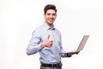 Businessman with laptop computer showing his thumbs up isolated on white background