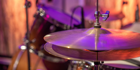 Drums, cymbals, hi hat on a beautiful background in the recording Studio. Room for musicians ' rehearsals. The concept of musical creativity.