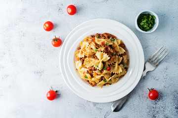 Minced beef tomato sauce pasta in a white plate