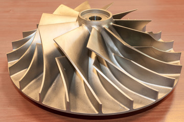 Impeller from a centrifugal compressor, disassembled and rejected due to quality requirements