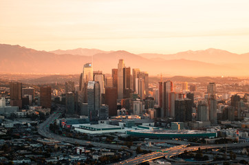 Downtown Los Angeles skyline from a helicopter at sunrise