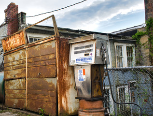 old abandoned gas station pump with outside tire sales center