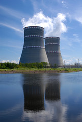 Russian Power plant with two coolers and violet flowers around it