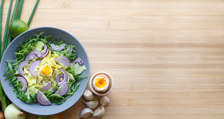 Vegetable patch with egg on wooden board