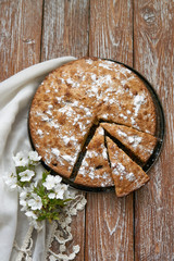 Homemade pie with cherries and apples on a dark rustic wooden board background. Rustic style food