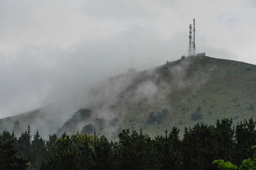 Fototapeta na wymiar Mount Ubieta between fog and rain