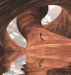 Man in carved canyon rock with lake