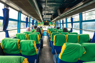 Fototapeta premium Waiting for departure to Lake Toba in a bus at the Amplas Bus Terminal in the city Medan on Sumatra