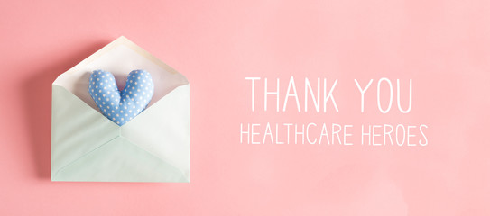 Thank You Healthcare Heroes message with a blue heart cushion in an envelope
