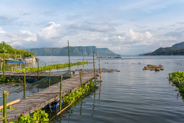 Lake Toba, the largest volcanic lake in the world, located in the middle of the northern part of...