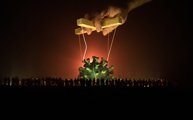 Coronavirus 2019-nCov novel coronavirus concept. Crowd looking on big Corona virus model at night...