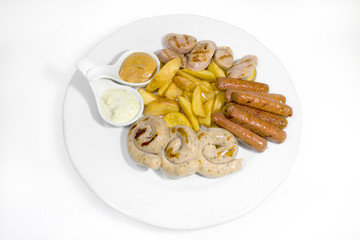 Three types of grilled sausages with French fries on a white plate on a white background, as well as horseradish and mustard as a seasoning