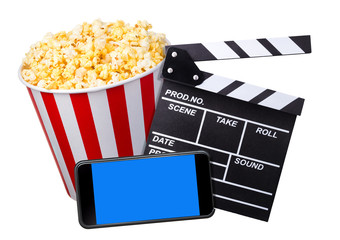 Flying popcorn, film clapper board and phone isolated on white background
