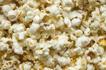 Texture background - scattered popcorn close-up and copy space