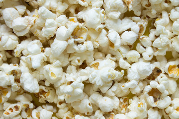 Texture background - scattered popcorn close-up and copy space