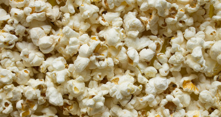 Texture background - scattered popcorn close-up and copy space