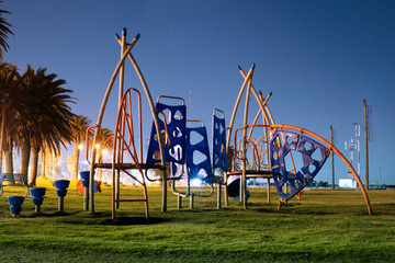 Playground in the park at night.