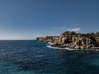 Areal view Island scenery, seascape Spain Majorca, beach bay Cala s'Almunia, beautiful coastline Mediterranean Sea. Balearic Islands, Cliff of Cala S'Almunia in Santanyí