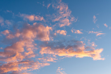 Texture of the sky. Beautiful sunset volumetric clouds. Lilac-golden clouds.