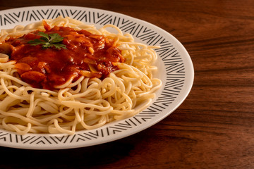 Italian macaroni on wooden table